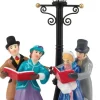 Dickens' Village Caroling by Lamplight