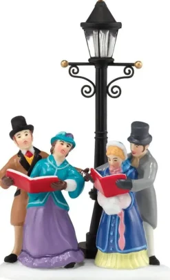 Dickens' Village Caroling by Lamplight