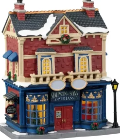 Lemax simpson & sons opticians verlicht kersthuisje Caddington Village 2023